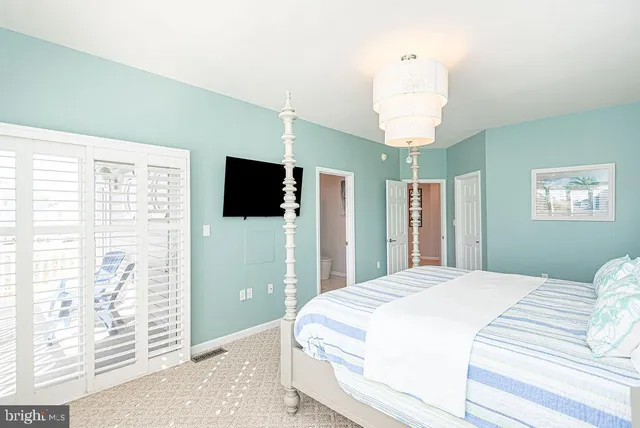 a front view of a house with yard and trees