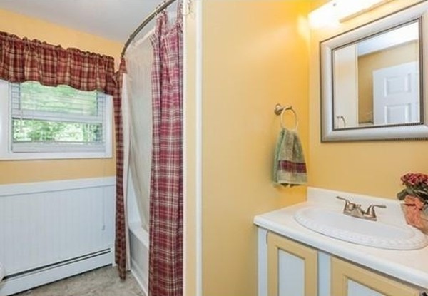 185 Monson Turnpike Road Ware, MA 01082 - Photo 20 of 24 a bathroom with a sink a vanity and a mirror