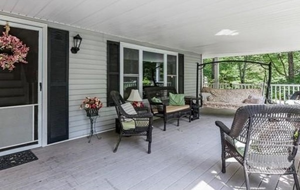 185 Monson Turnpike Road Ware, MA 01082 - Photo 7 of 24 a view of a patio with a dining table and chairs