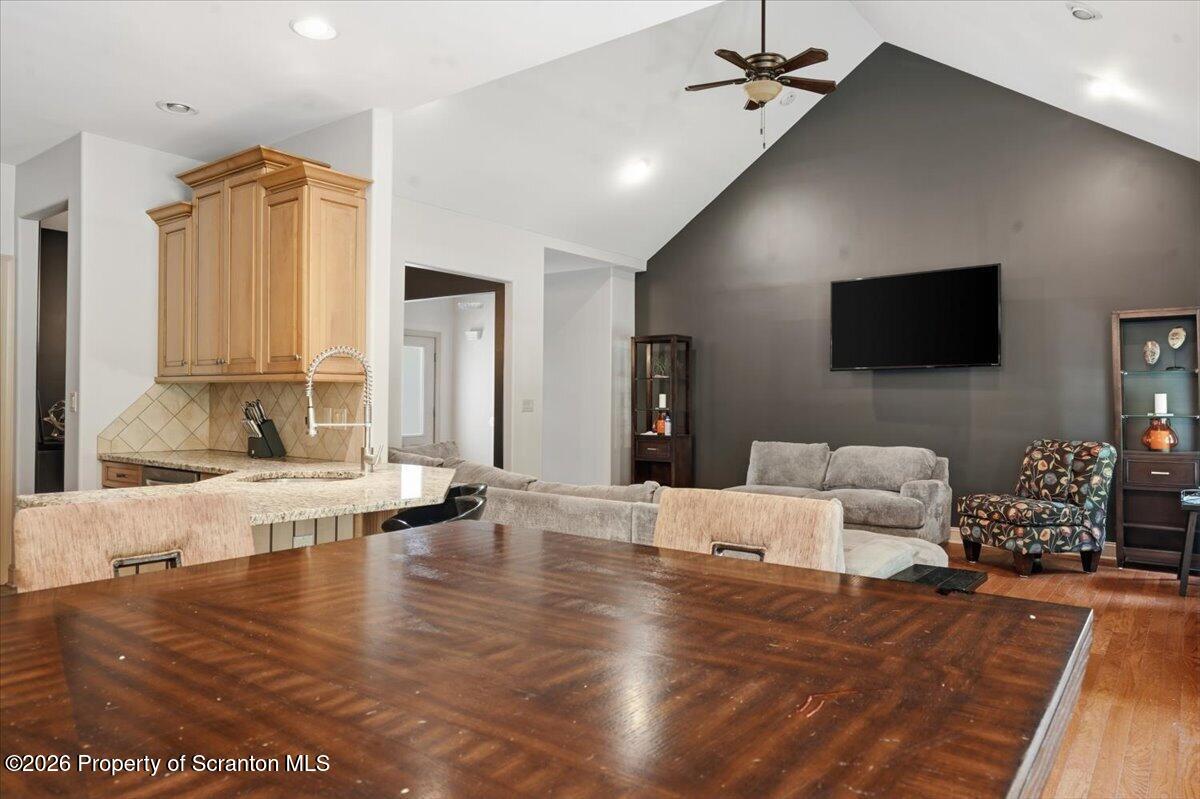 99 Hilltop Road Waverly, PA 18471 - Photo 15 of 41 a living room with furniture and a flat screen tv