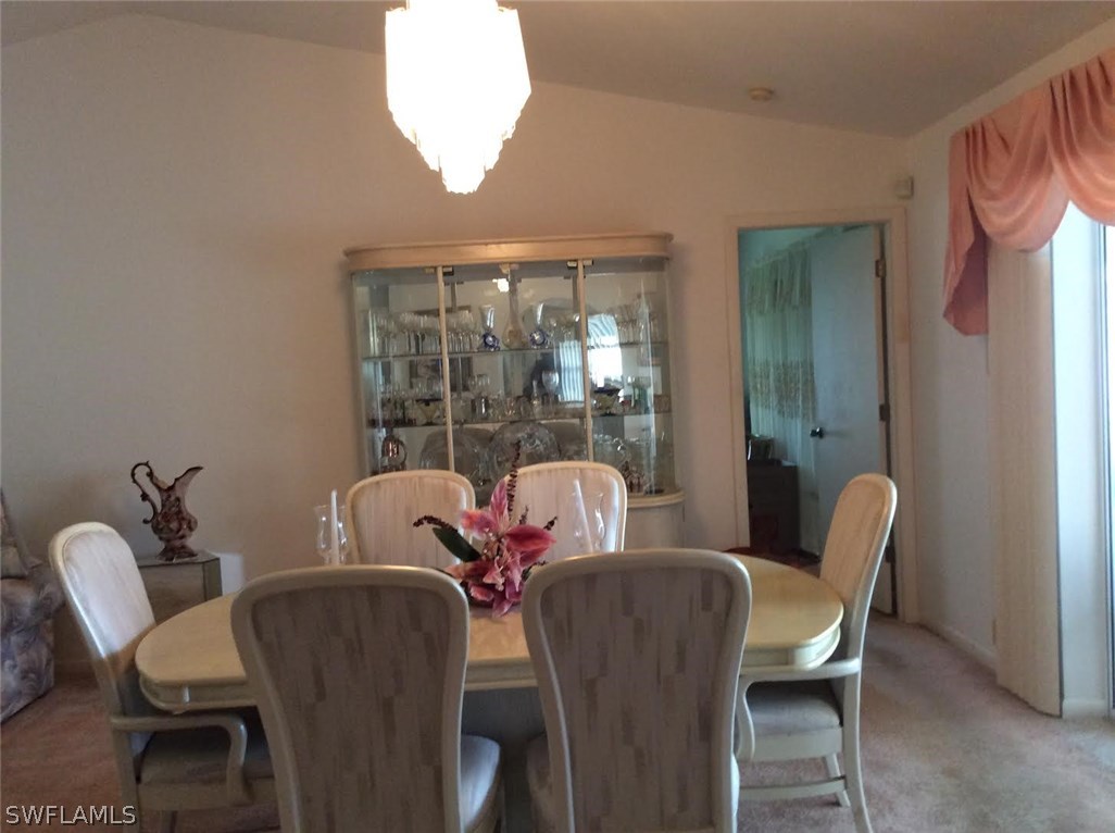 225 Danby Road Lehigh Acres, FL 33936 - Photo 11 of 20 a dining room with furniture and window