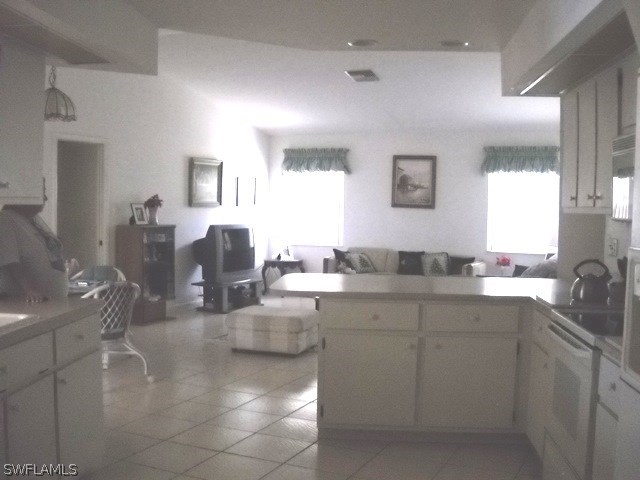 225 Danby Road Lehigh Acres, FL 33936 - Photo 13 of 20 a kitchen with cabinets and sink