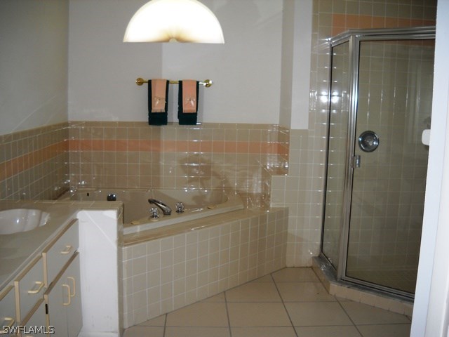 225 Danby Road Lehigh Acres, FL 33936 - Photo 15 of 20 a bathroom with a sink a toilet and shower
