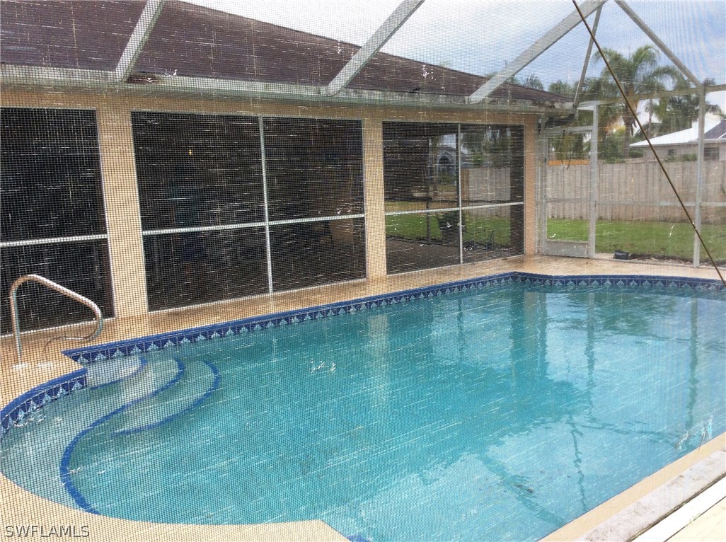 225 Danby Road Lehigh Acres, FL 33936 - Photo 8 of 20 a view of a backyard of a house