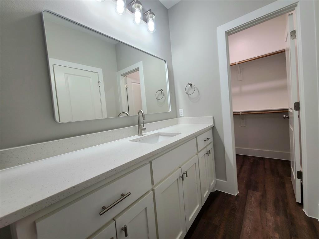 507 Northeast 5th Avenue Durant, OK 74701 - Photo 28 of 35 a bathroom with a sink and a mirror