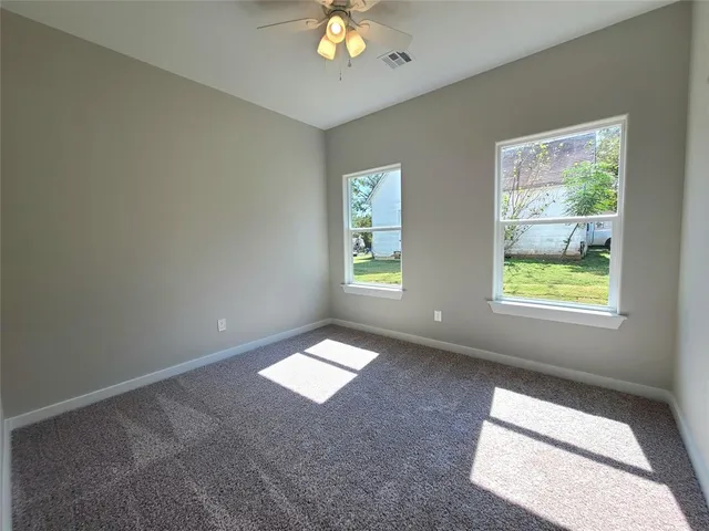 a view of an empty room and window