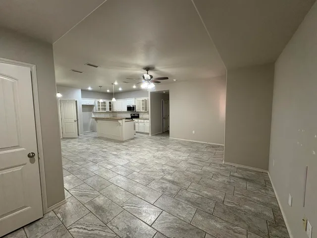 a view of a kitchen and a window