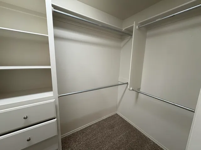 a view of an empty walk in closet