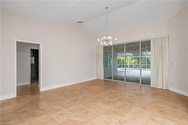 a view of an empty room with glass door