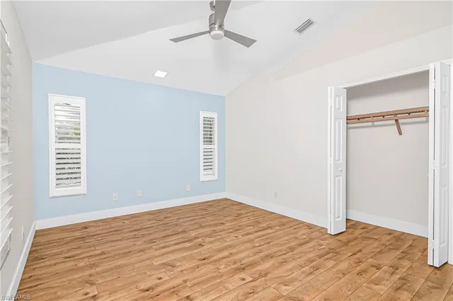 a bathroom with a sink a mirror a toilet and shower
