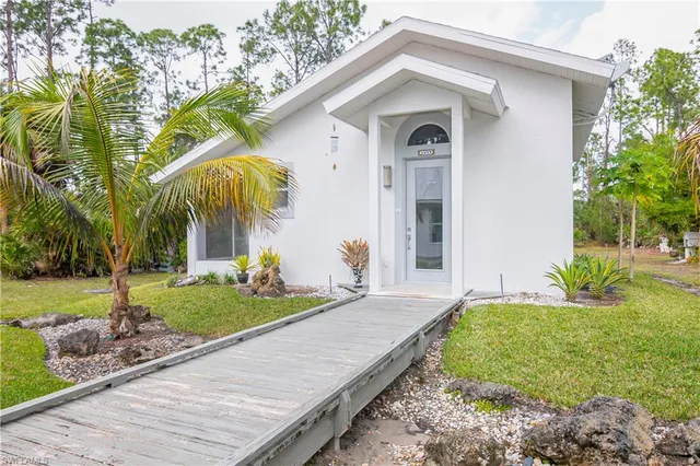 a aerial view of a house with a yard