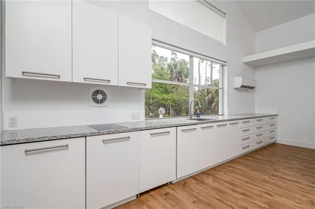 a bedroom with bed and a flat screen tv