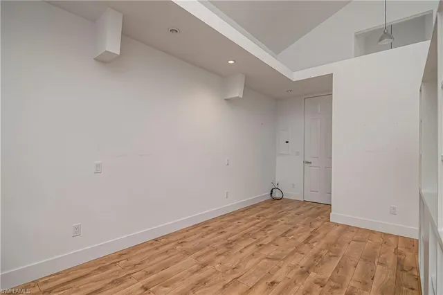 a bathroom with a granite countertop sink and a toilet