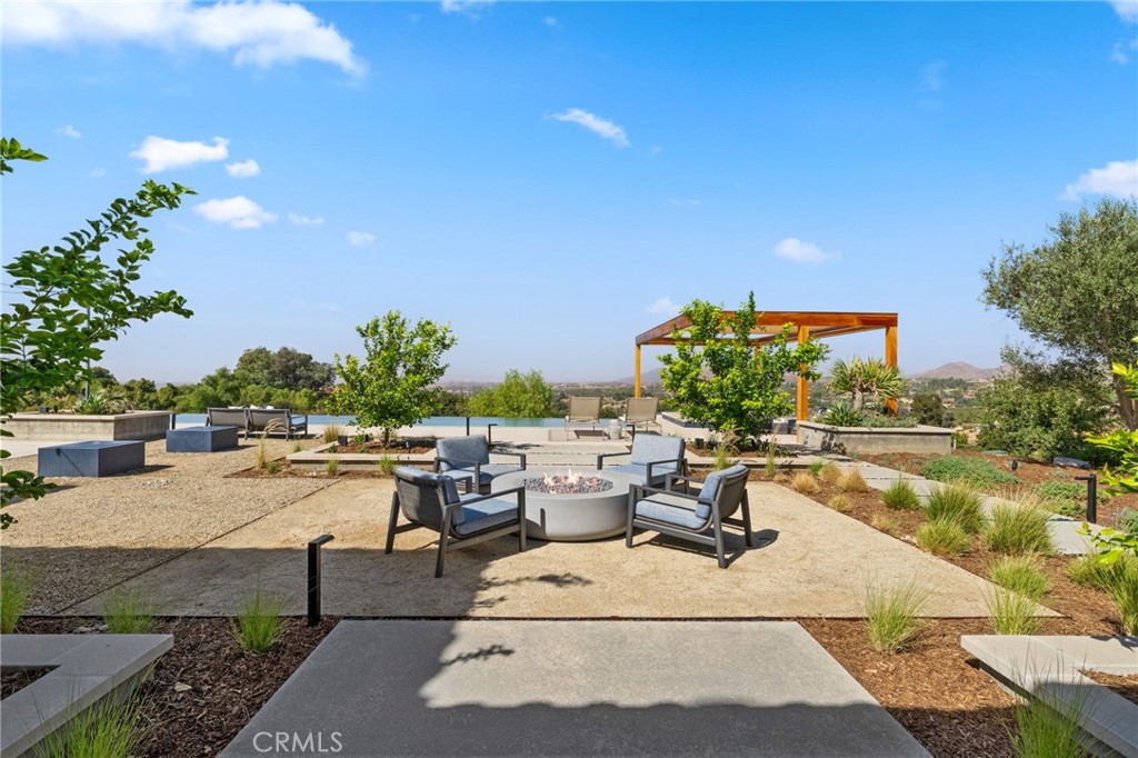 39893 Calle Breve Temecula, CA 92592 - Photo 48 of 70 a view of a swimming pool with outdoor seating and plants