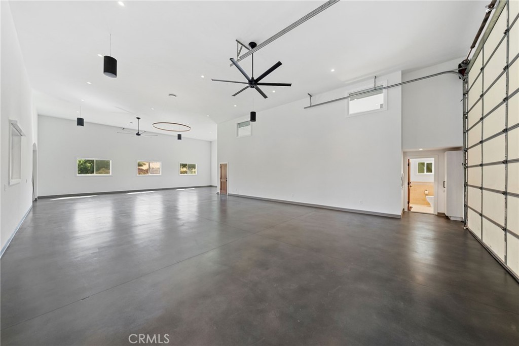 39893 Calle Breve Temecula, CA 92592 - Photo 60 of 70 a view of a livingroom with a ceiling fan and window