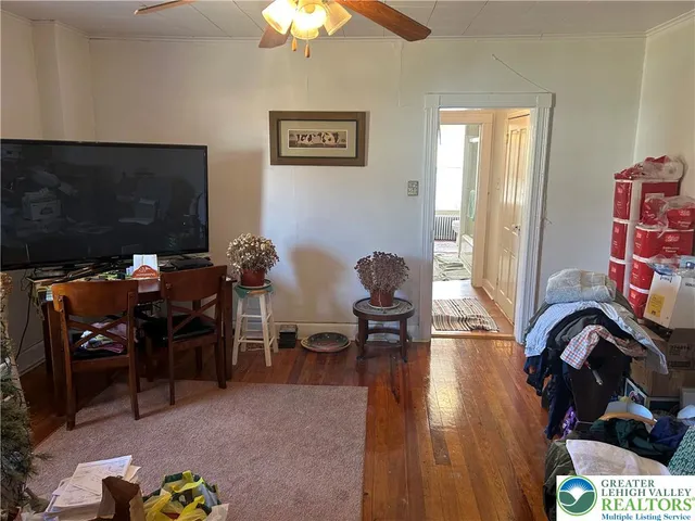 a view of a room with workspace and a window