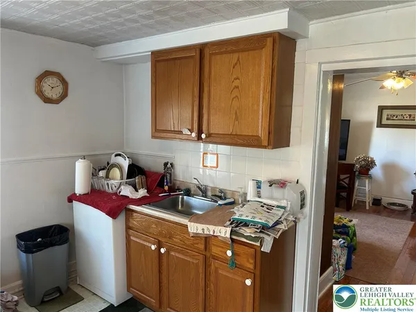 a kitchen with a stove and cabinets