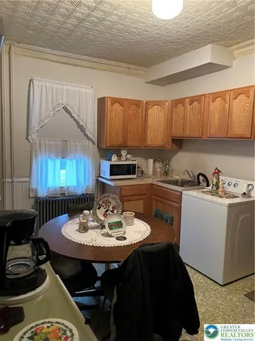 a kitchen with a sink cabinets and counter space