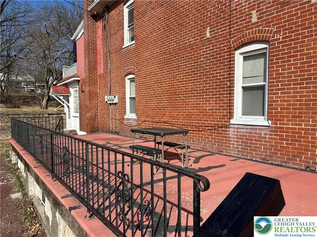 a view of a patio with two couches and deck