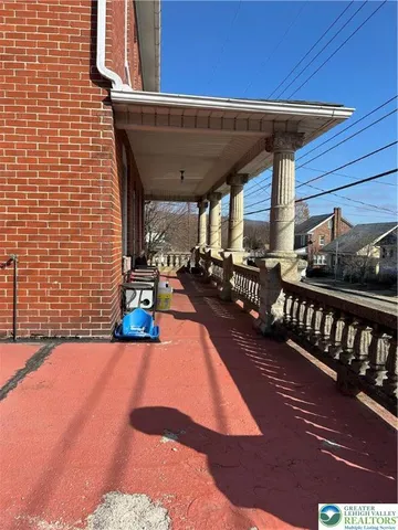 a view of a balcony with chairs