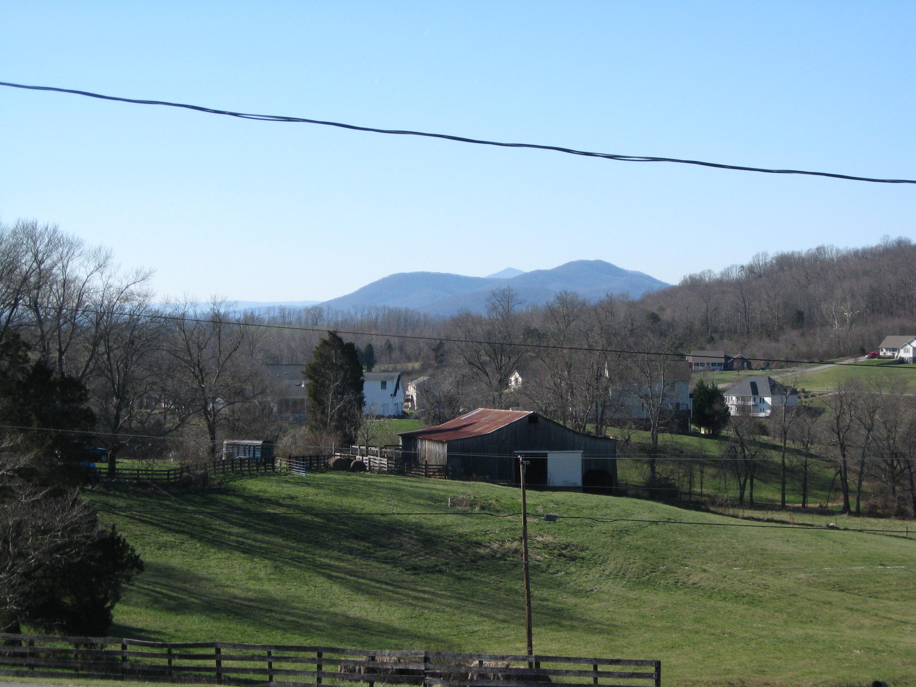 1230 Mill Iron Road Goodview, VA 24095 - Photo 8 of 21 a view of a house with a yard