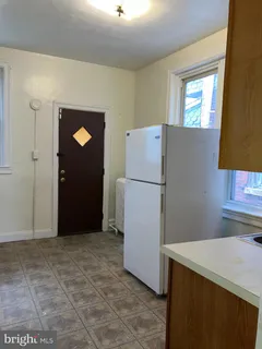 a view of a kitchen with a refrigerator