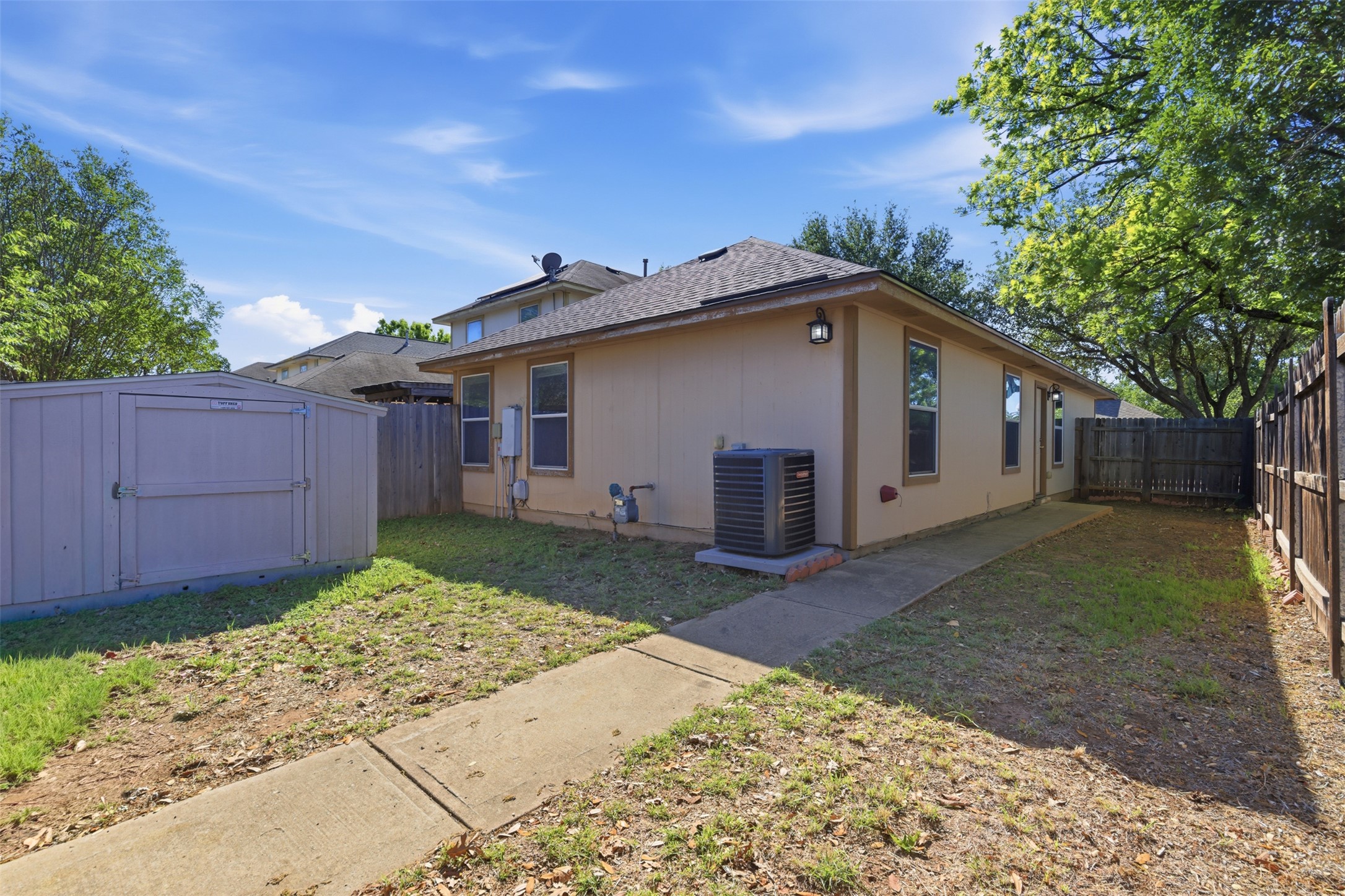 4529 Secure Lane, Unit 31 Austin, TX 78725 - Photo 27 of 38 a view of a house with a yard