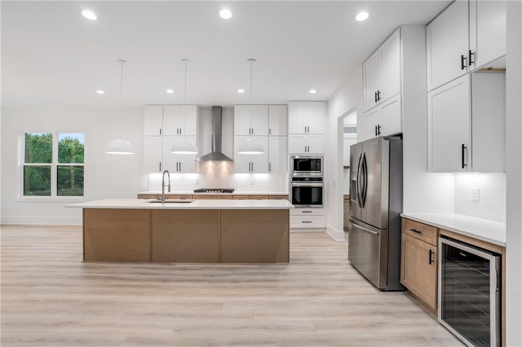 3766 Cheyenne Lane Jefferson, GA 30549 - Photo 11 of 52 a kitchen with stainless steel appliances granite countertop a refrigerator and a stove top oven