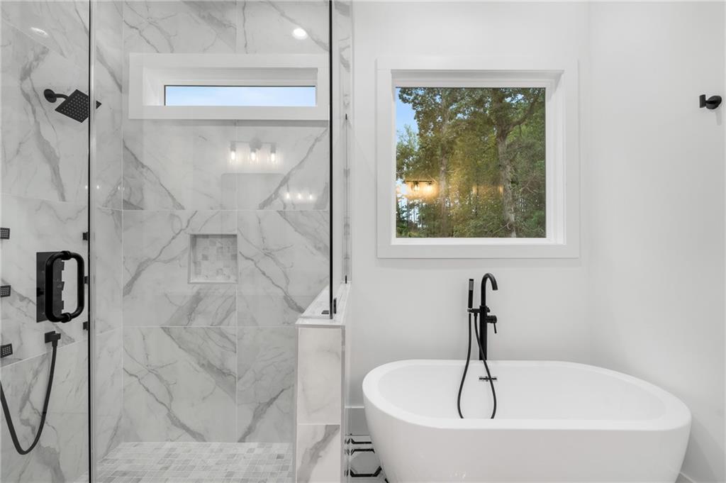3766 Cheyenne Lane Jefferson, GA 30549 - Photo 26 of 52 a white bath tub sitting next to a shower
