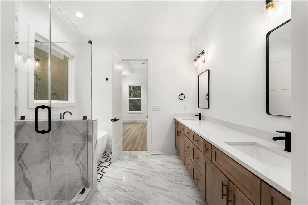 3766 Cheyenne Lane Jefferson, GA 30549 - Photo 27 of 52 a spacious bathroom with a double vanity sink mirror and double