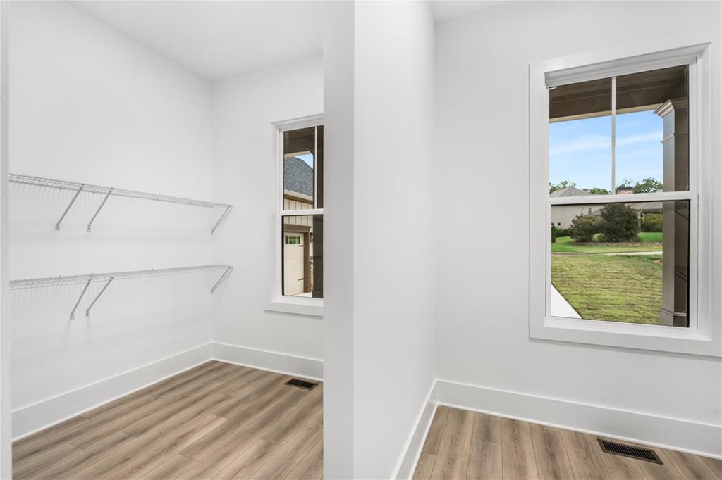 3766 Cheyenne Lane Jefferson, GA 30549 - Photo 28 of 52 a view of an empty room with a window and wooden floor