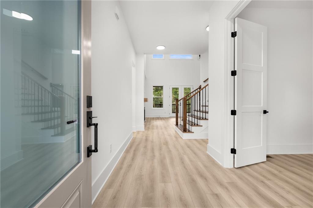 3766 Cheyenne Lane Jefferson, GA 30549 - Photo 4 of 52 a view of a hallway with wooden floor and staircase