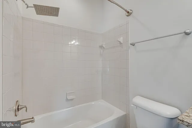 a view of an empty room with a staircase