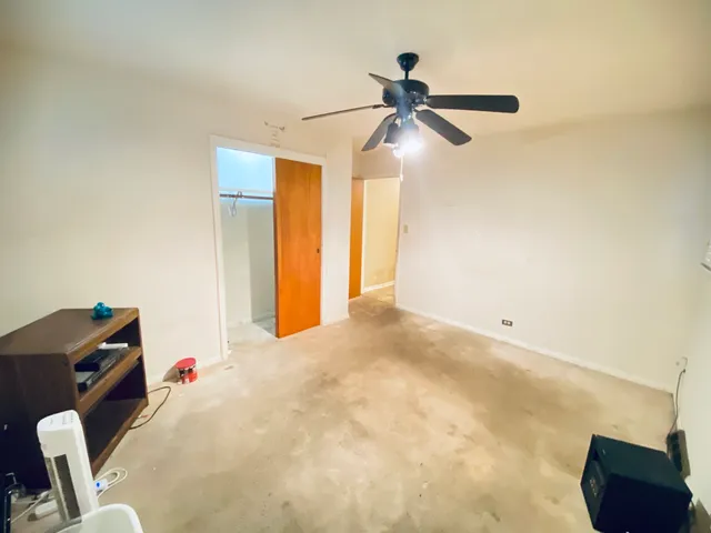 a bedroom with a bed and cabinets