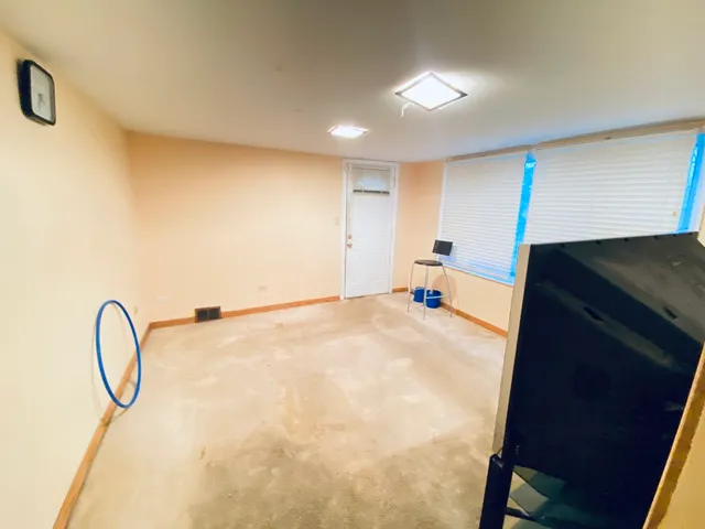 a bathroom with a sink mirror and vanity