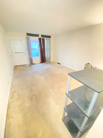 a view of empty room with windows