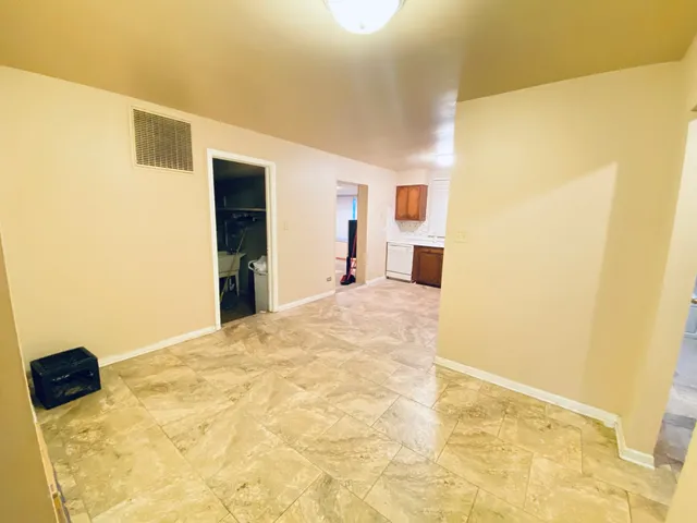 a view of a big room with windows