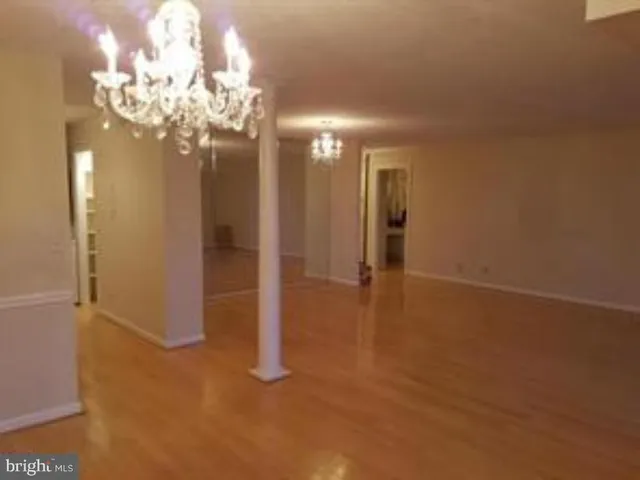 a view of a livingroom with furniture and a chandelier