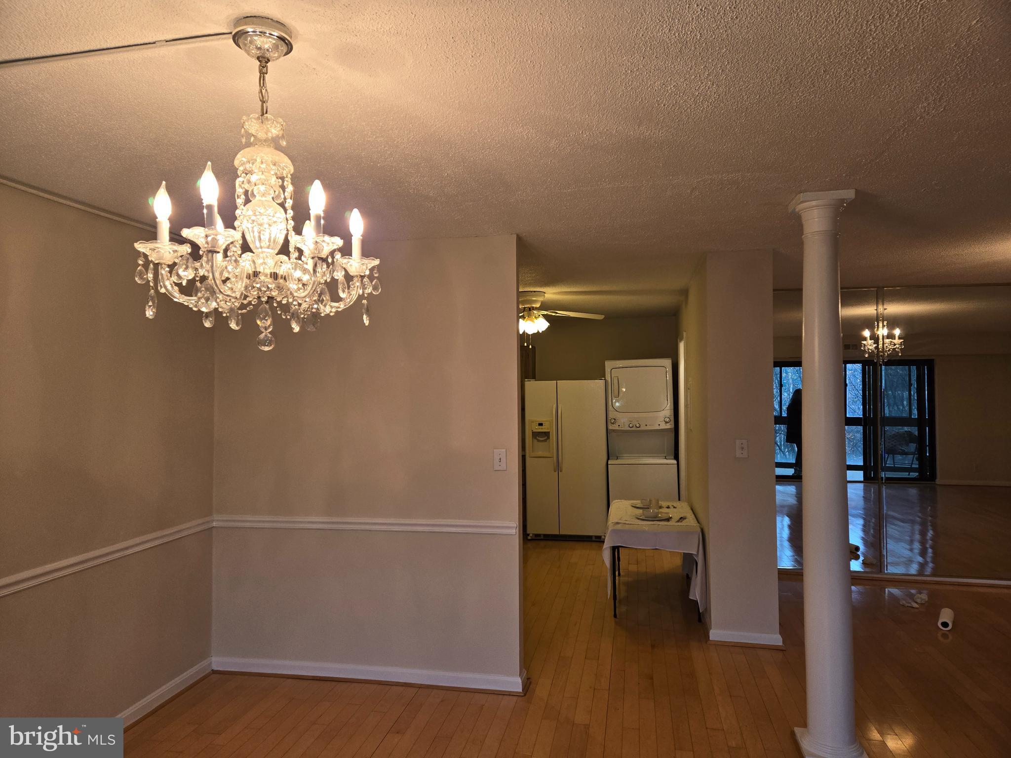 8370 Greensboro Drive, Unit 806 McLean, VA 22102 - Photo 13 of 31 a view of a hallway with chandelier and entryway
