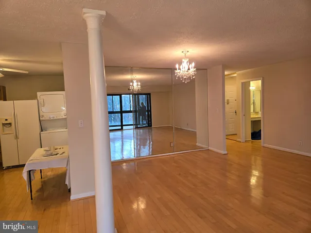 a view of front door with wooden floor