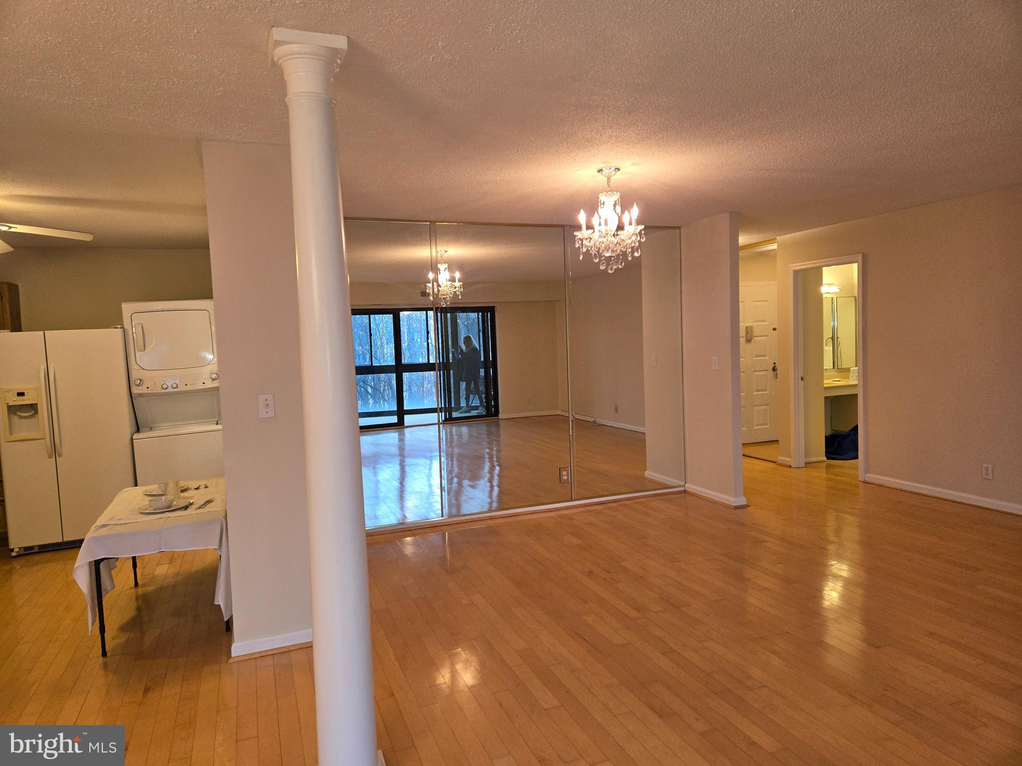 8370 Greensboro Drive, Unit 806 McLean, VA 22102 - Photo 14 of 31 a view of a livingroom with furniture and a chandelier