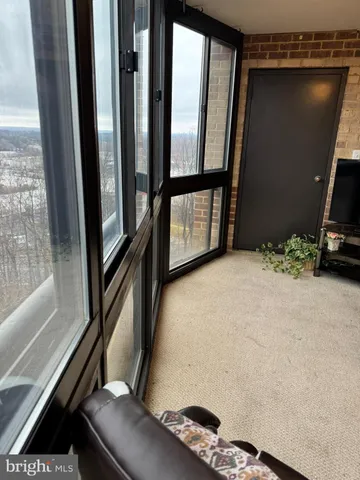 a spacious bathroom with a granite countertop sink and a mirror
