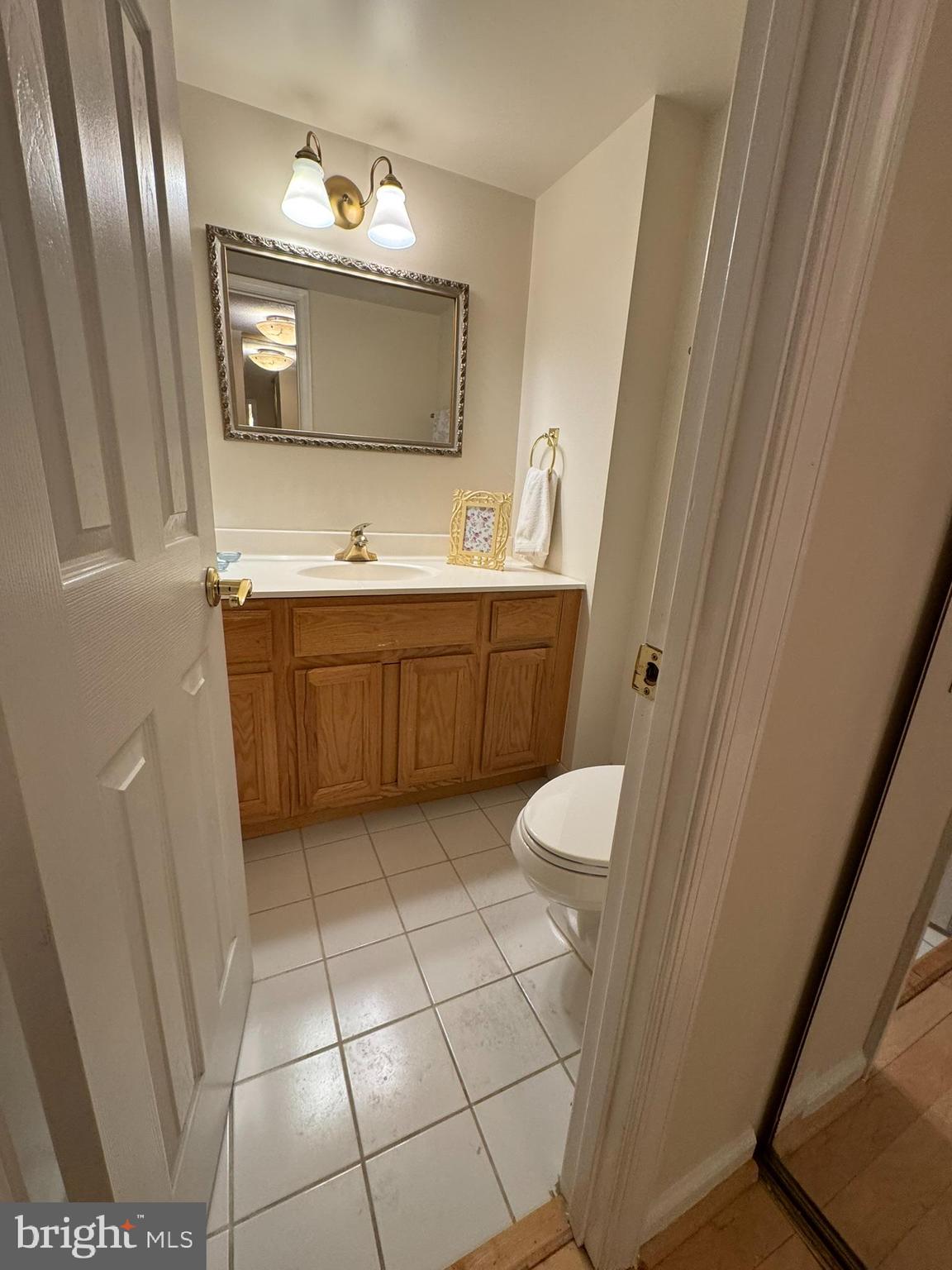 8370 Greensboro Drive, Unit 806 McLean, VA 22102 - Photo 20 of 31 a spacious bathroom with a granite countertop sink and a mirror
