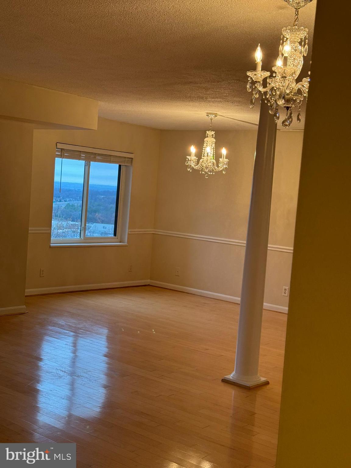 8370 Greensboro Drive, Unit 806 McLean, VA 22102 - Photo 21 of 31 a view of livingroom with hardwood floor and window
