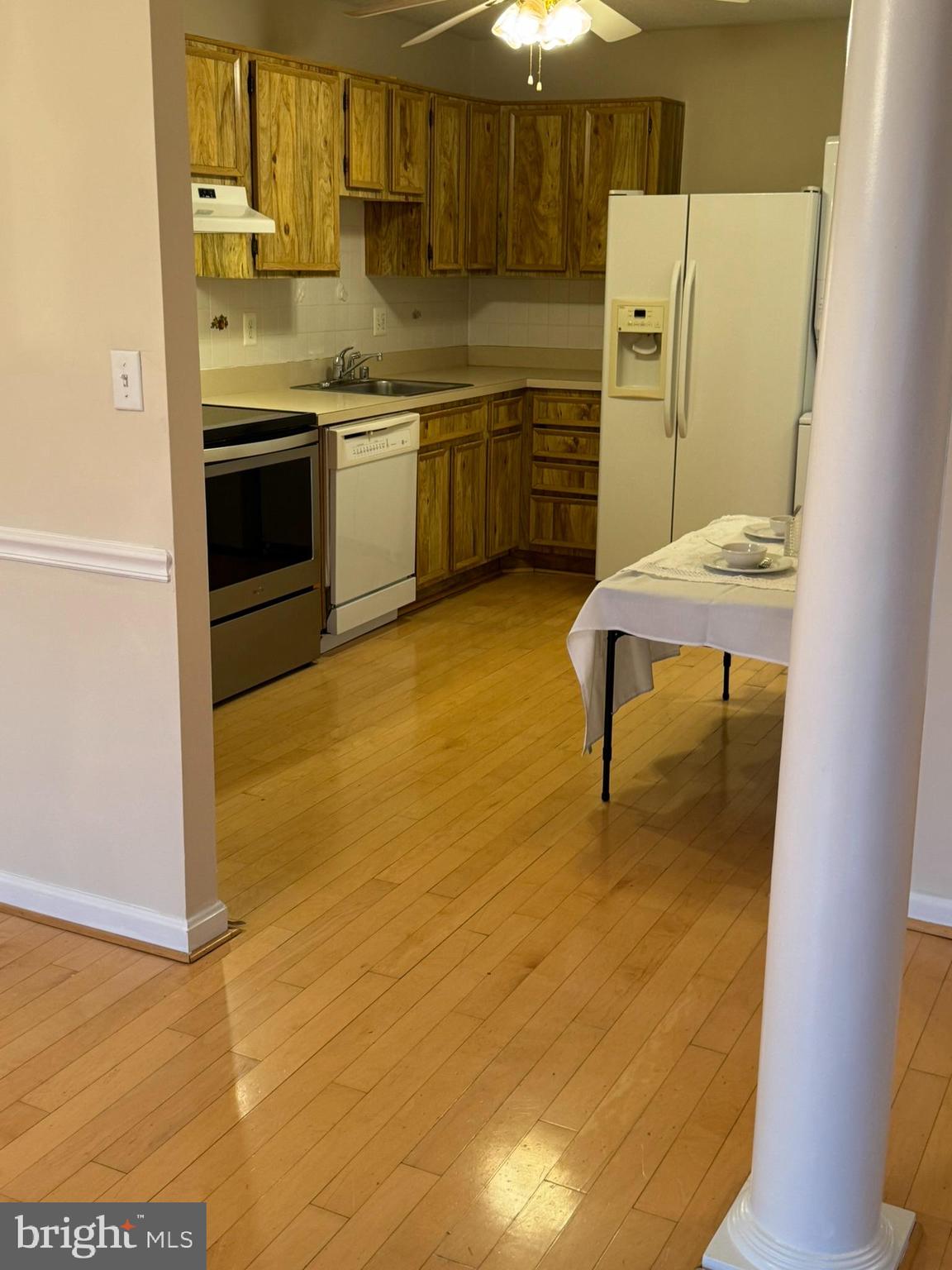 8370 Greensboro Drive, Unit 806 McLean, VA 22102 - Photo 22 of 31 a kitchen with a sink cabinets and wooden floor