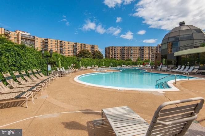 8370 Greensboro Drive, Unit 806 McLean, VA 22102 - Photo 9 of 31 a view of a swimming pool and a chairs
