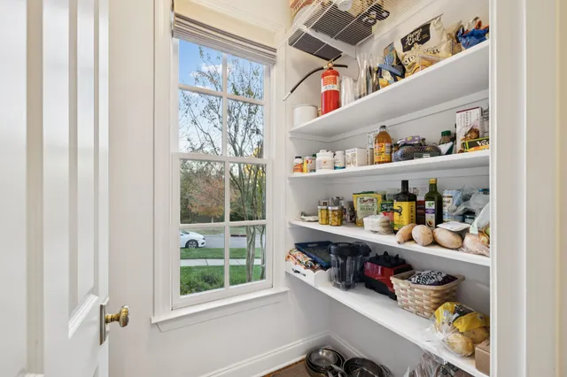 a kitchen with stainless steel appliances granite countertop a stove a microwave a sink and cabinets