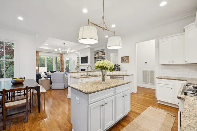 a kitchen with stainless steel appliances a refrigerator sink and cabinets