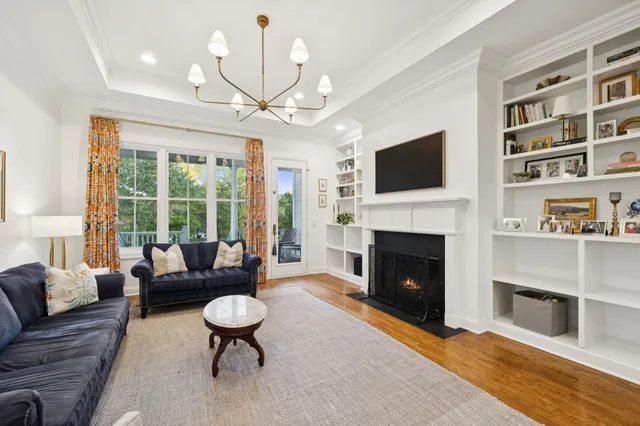 a bathroom with a granite countertop sink and a toilet