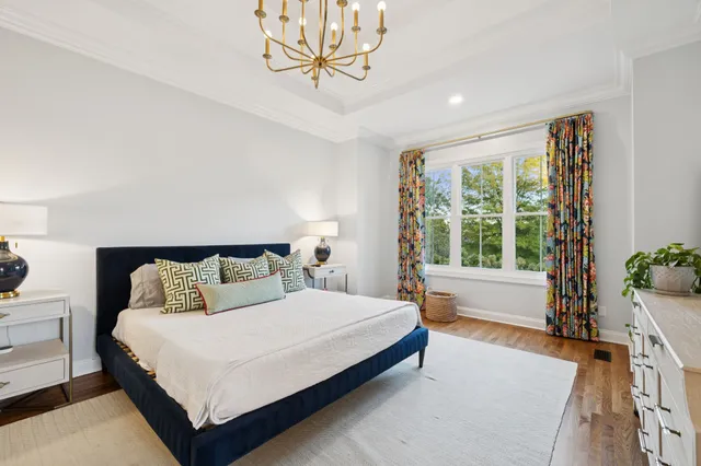 a bedroom with a bed and dresser